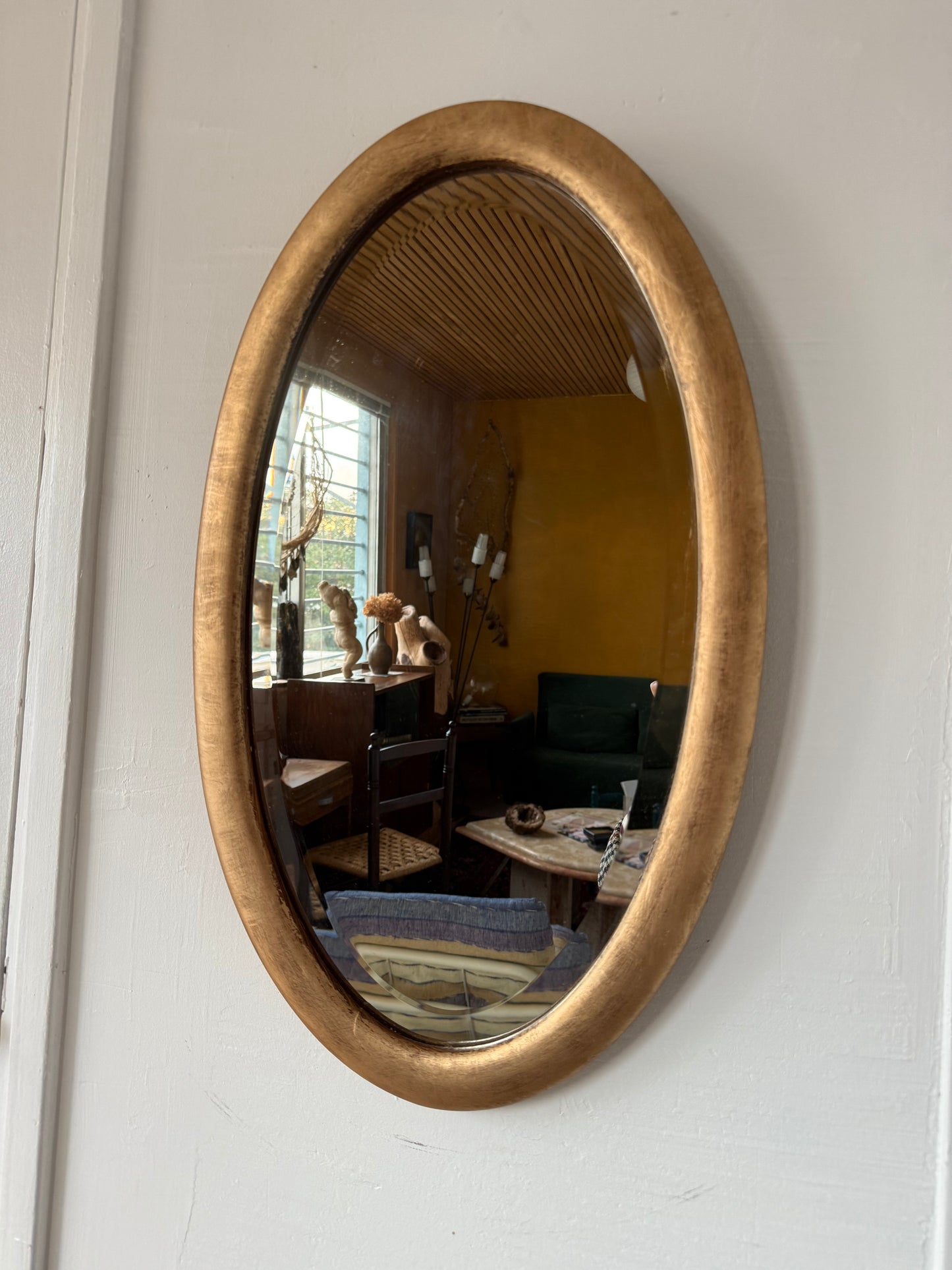 Miroir doré ovale ancien glace biseautée