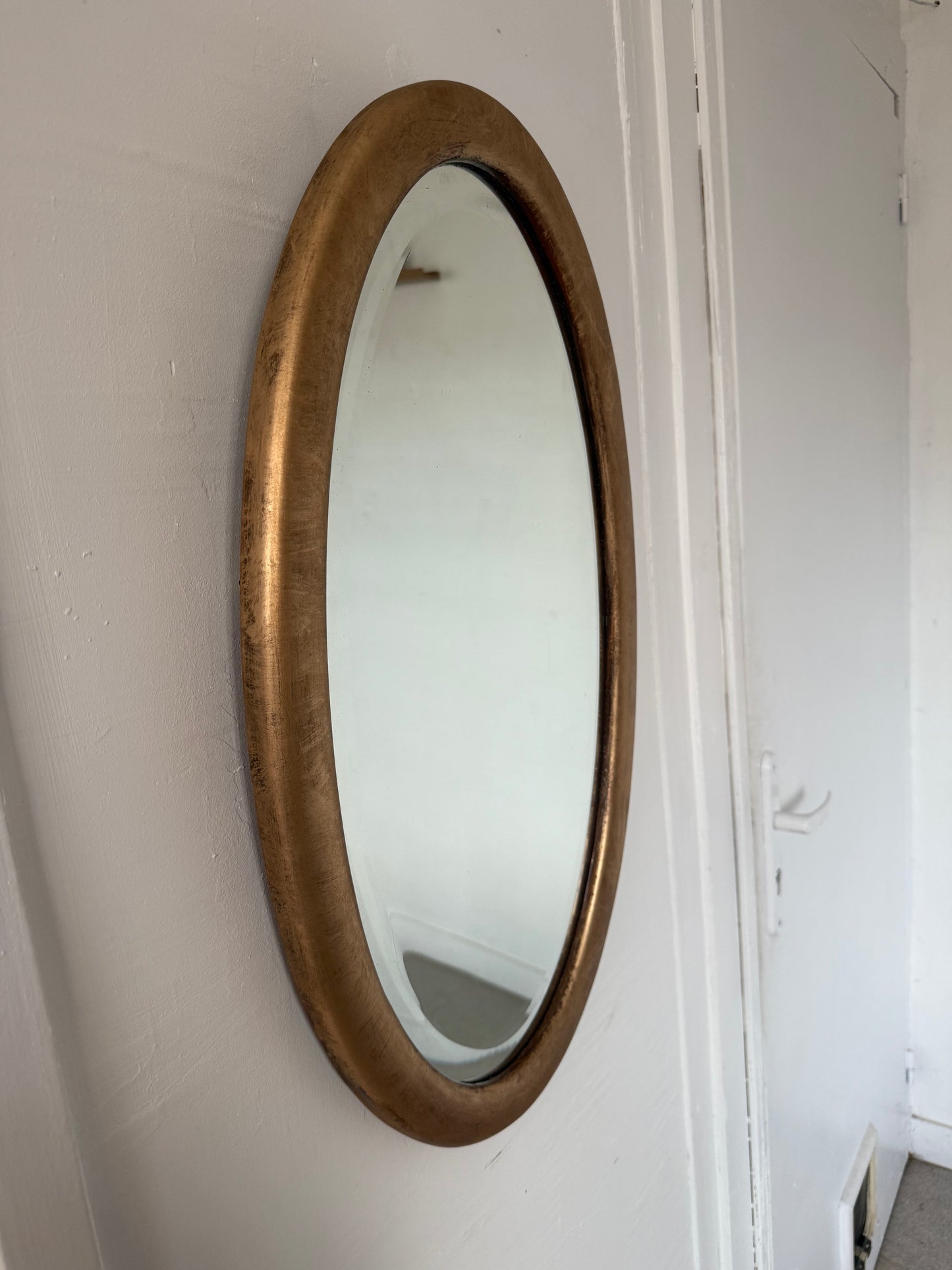 Miroir doré ovale ancien glace biseautée