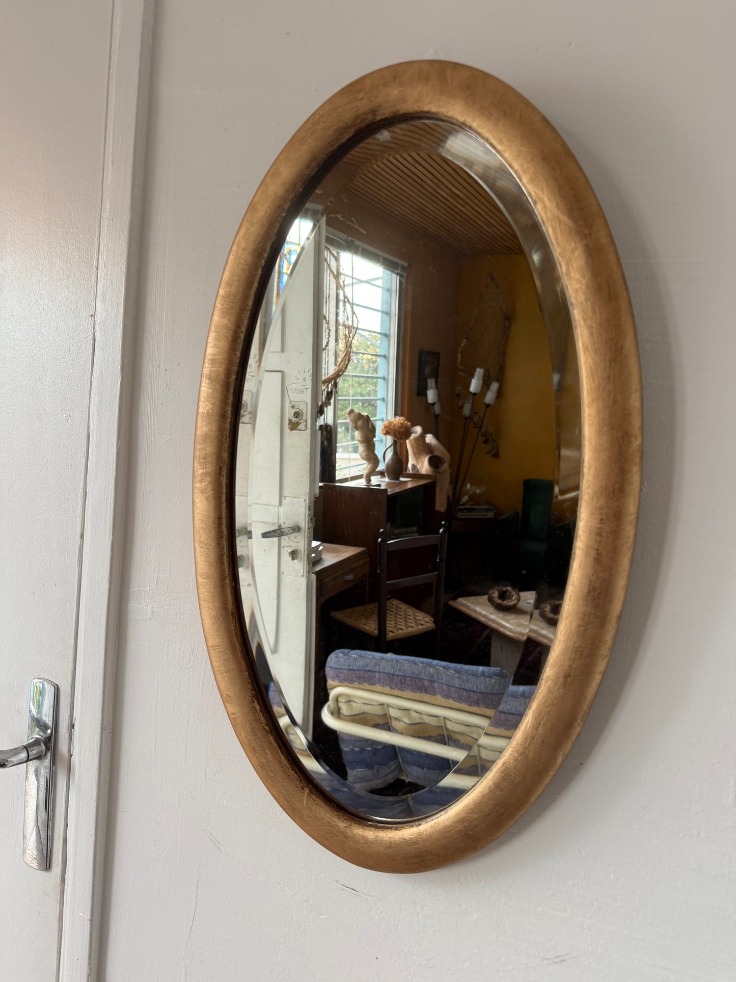 Miroir doré ovale ancien glace biseautée