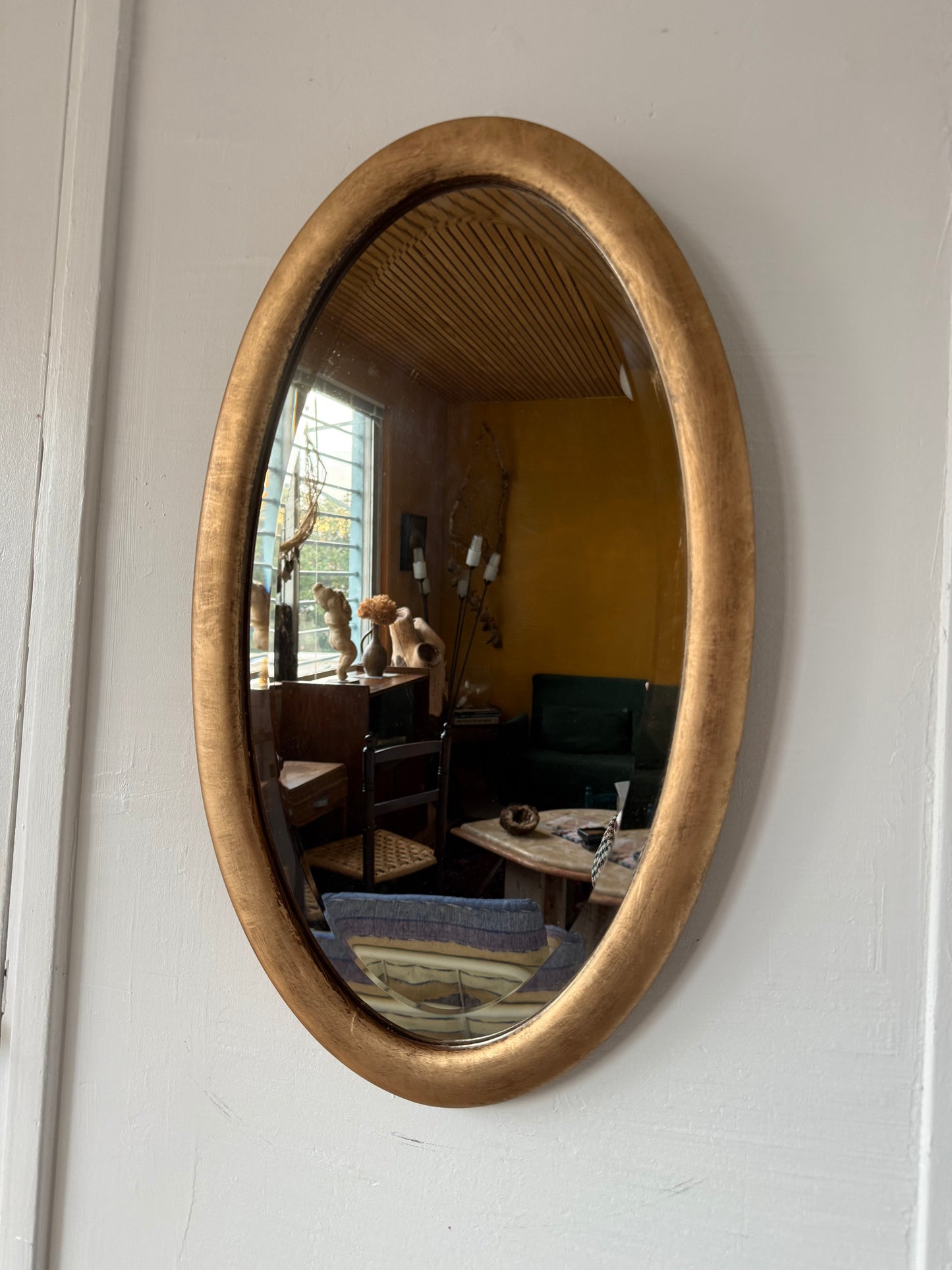 Miroir doré ovale ancien glace biseautée