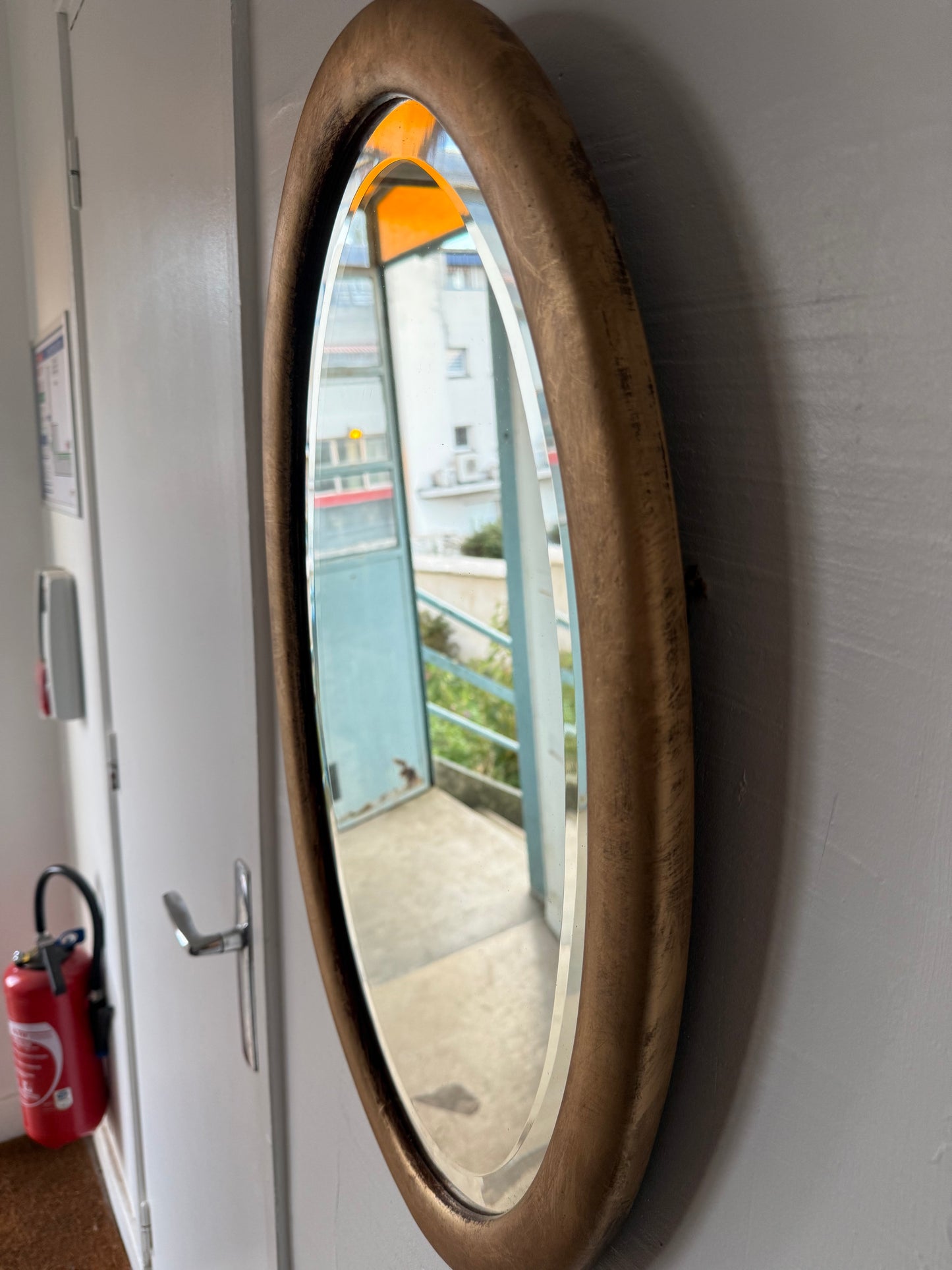 Miroir doré ovale ancien glace biseautée