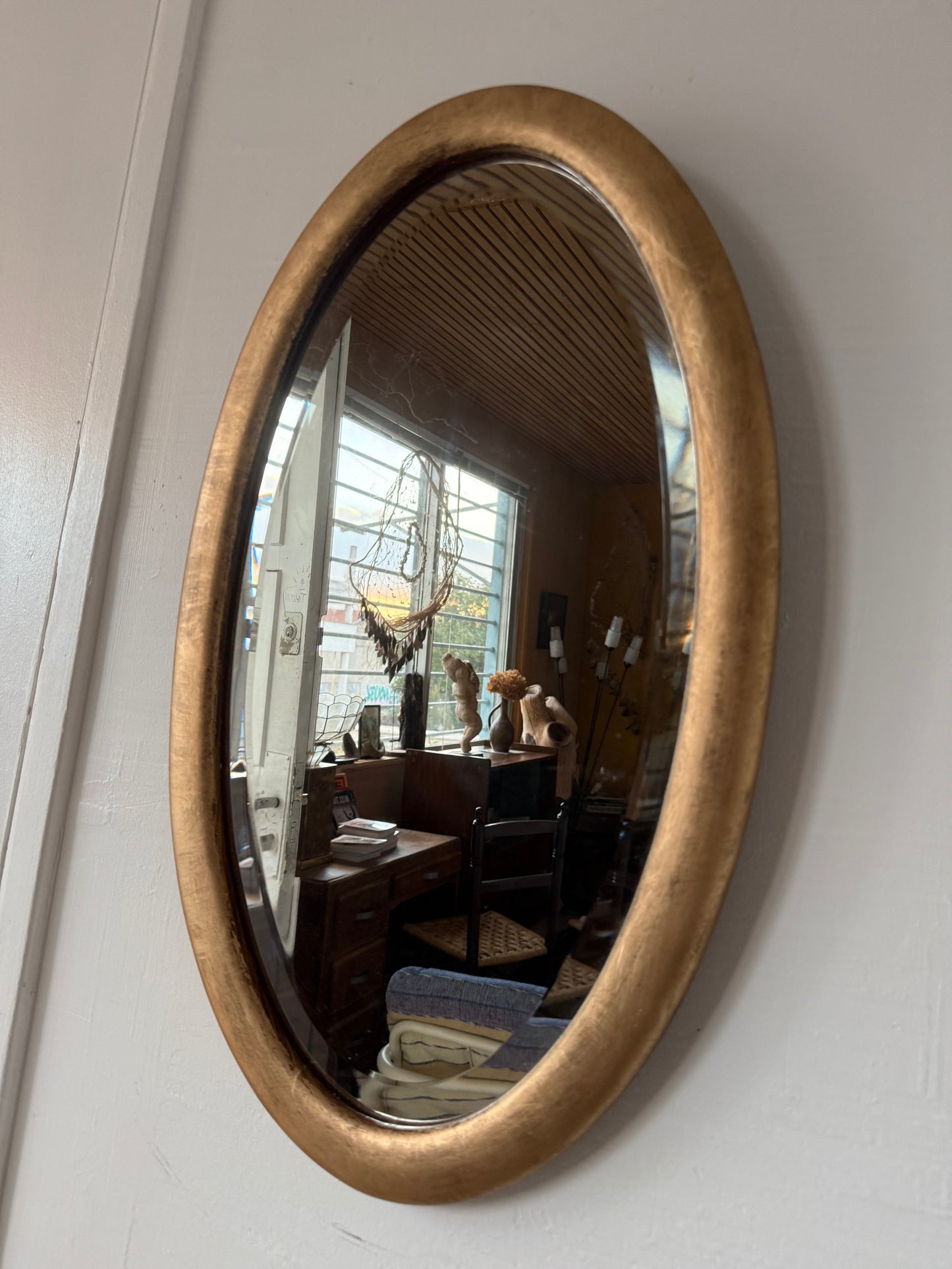 Miroir doré ovale ancien glace biseautée