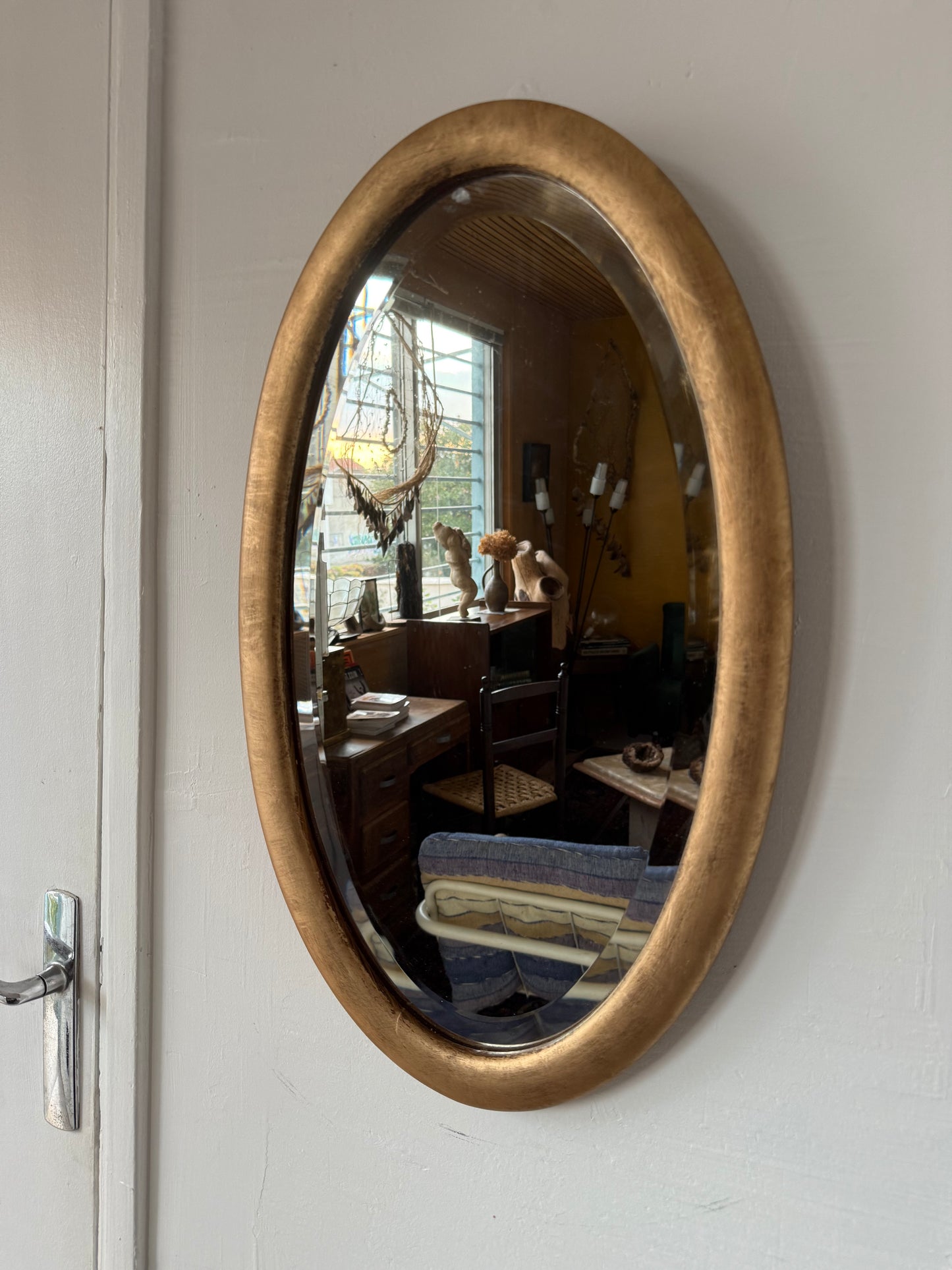 Miroir doré ovale ancien glace biseautée