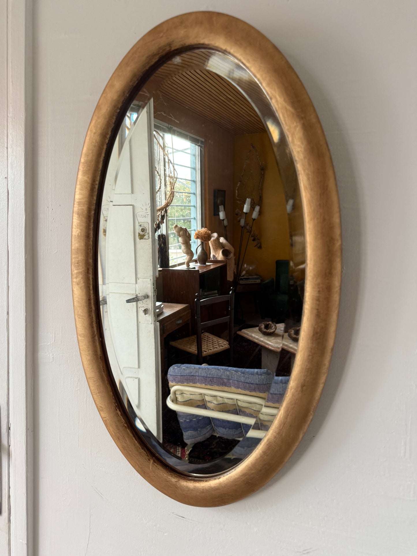 Miroir doré ovale ancien glace biseautée