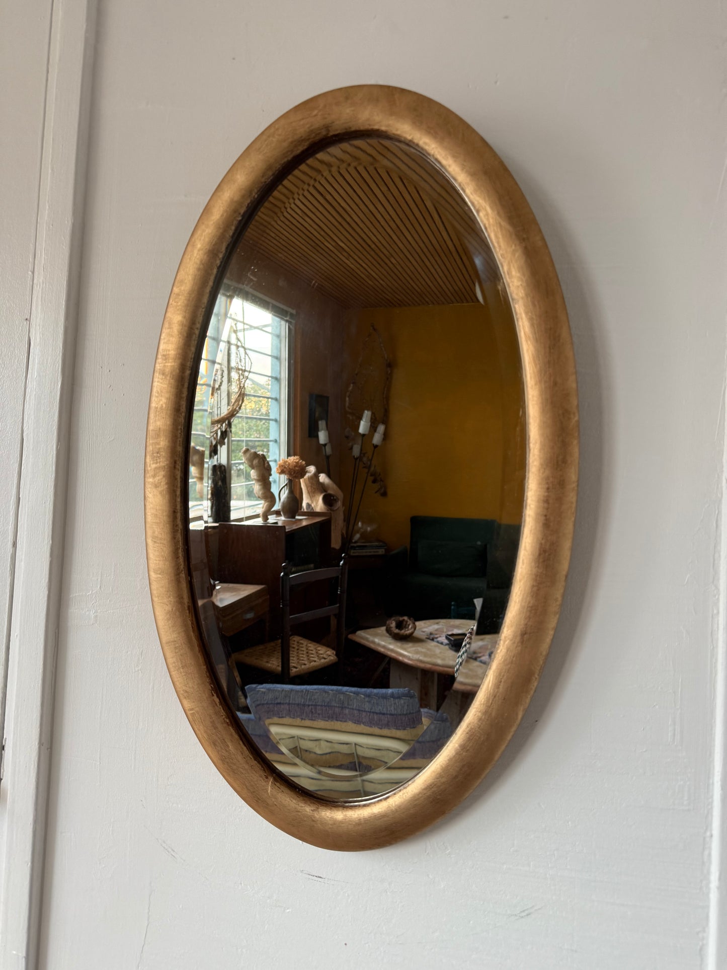 Miroir doré ovale ancien glace biseautée