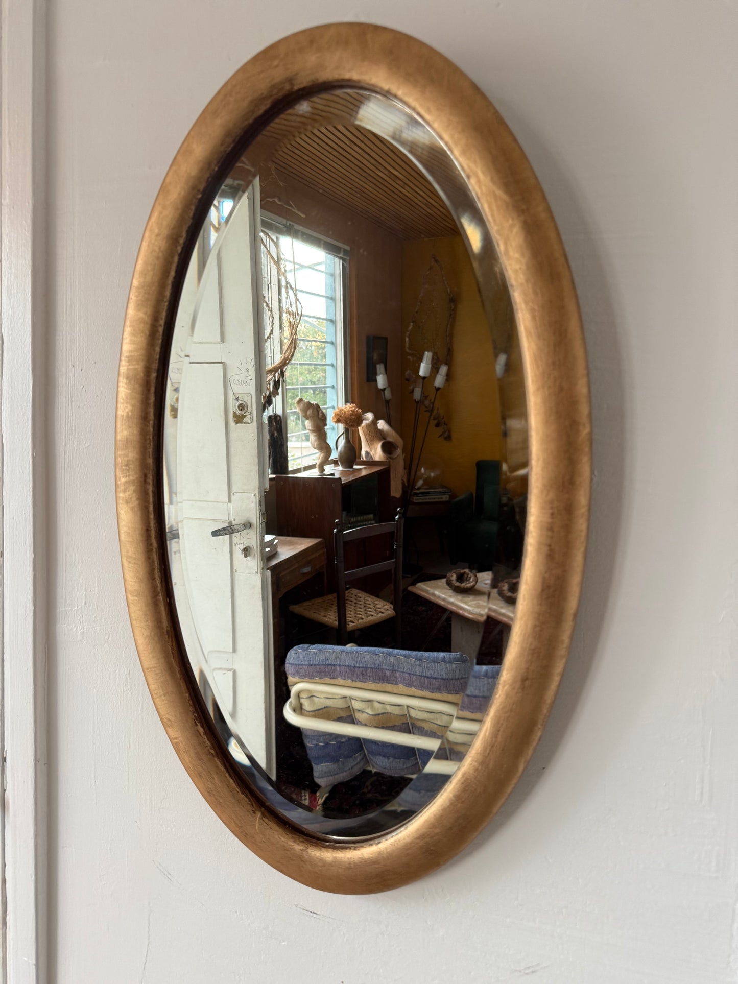 Miroir doré ovale ancien glace biseautée